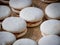 Close-up shot of white sweet alfajor sweets on a wooden table