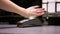 Close-up shot of woman attaches hand with microchip implant to terminal doing contactless payment.