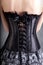 Close-up shot of woman in black corset