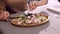 Close up shot of woman eating Caesar salad at cafe