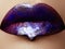 Close-up shot of woman lips with glossy plum lipstick. Perfect p