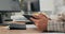 Close-up shot of a woman\'s hands holding a tablet, she clicks fingers on the screen, scrolls, checks email, news