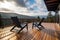 close up shot of a wooden mountain lodge deck with chairs