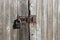 Close Up Shot Of Wooden Wall. Iron Lock On Wooden Door.
