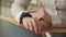 Close up shot of a young girl`s hands, who sets the clock on a smart watches