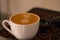 Close-up shots of nice espresso coffee cup on coffee beans fragrant aroma. Home made