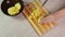 Close-up shots of a potato chopped into small cubes with a knife on a cutting board