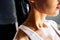 Close up shoulders and neck of sporty girl in drop of sweat on skin after workout