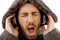 Close up of shouting male listening to music