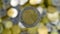 A close-up shows one 2 euro coin. This is money. Finance currency symbol. Blurred money background. On the reverse side there is
