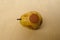 close-up shriveled yellow ripe pear covered with rot, gray, white fluffy mold, concept mold fungi on surface products, spore