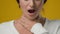Close up sick female studio yellow background Indian ill woman girl lady suffer pain ache throat painful swallowing