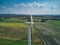 close up side aerial view of a rural wind turbine in the English countryside