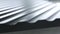 Close up side of black wavy roof tiles on blurred background. Action. Black wavy roofing material, constructional