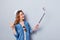 Close up side profile photo beautiful she her lady traveler hand arm telephone metal selfie stick blogger make pictures