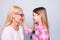 Close up side profile photo funky two people blond hair she her granny little granddaughter ready holiday celebrate look