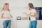 Close up side profile view photo two people mum and teen daughter make dishes together check soup cooker chatting enjoy