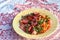 Close-up side shoot of oil tomato and carrot salad