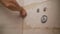 Close-up side view of a builder applying tiles and spacers between tiles that have been securely applied to the adhesive on the