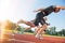 Close-up side view of cropped people ready to race on track field