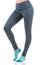 Close up side view of fit woman legs warming up in colorful striped sports leggings wearing blue socks