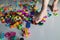 Close up Side View of Foot stepping on scattered legos on the floor