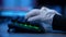 Close-up side view of hands in white gloves typing on backlit keyboard. Unrecognizable hacker programmer coding virtual
