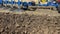 Close-up side view a knife plow in a field. Start tillage after harvest