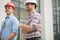 Close up side view portrait. cheerful young constructors in casual outfit