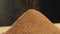 Close-up of sifting cocoa powder sieve on a dark background