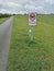 Close-up of a sign saying in Dutch dogs are not allowed to dig in this