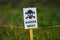 Close-up of a sign with a skull warning of danger in a minefield