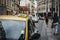 Close up of a sign on yellow taxi on a street in Prague, Czech Republic