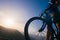 Close up silhouette of an athlete mountain biker riding his bike on rocky mountains