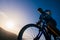 Close up silhouette of an athlete mountain biker riding his bike on rocky mountains