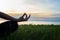 Close up Silhouette hands. Woman do yoga outdoor. Woman exercising vital and meditation for fitness lifestyle club at the sunset b