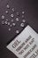 Close up silica gel or desiccant in paper bag on black background