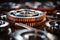 Close up of silver metallic engine gear wheels immersed in oil on industrial background