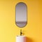 Close up of sink in yellow bathroom
