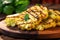 close-up of sizzling grilled cauliflowers on a wooden plate