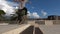 Close up of skater skateboarder man doing ollie trick in slow motion, jump over the steps