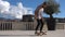 Close up of skater skateboarder man doing ollie trick in slow motion, jump while riding