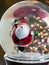 Close Up of a Skating Santa Snow Globe