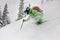 Close-up of skier descending a snow-covered slope and splash of snow around him