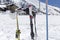 Close up of skis in the snow with background blue sky and the ski slope