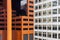 Close up of skyscraper with buildings reflecting in the windows