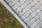 Close-up of slab stone paved path way at park or backyard. Walkway footpath road at house yard garden