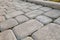 Close-up of slab stone paved path way at park or backyard. Walkway footpath road at house yard garden