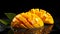 close-up of a slashed juicy mango against a black background