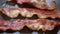 Close-up of a slice of bacon fried on grill